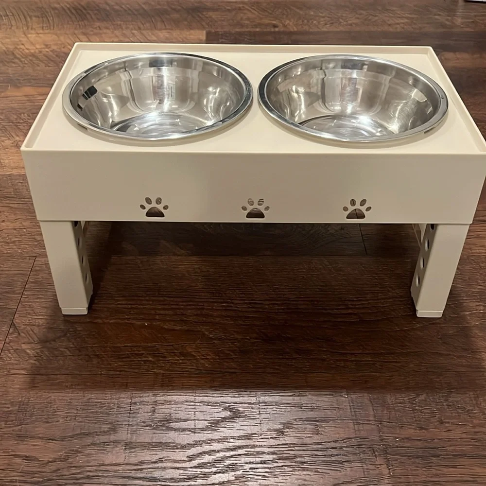 Cream Colored Dog Feeder and Bowls